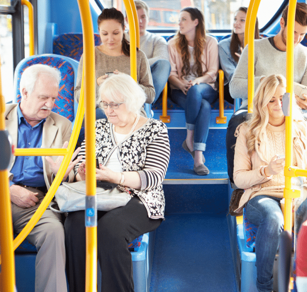 A group of people sitting inside a bus