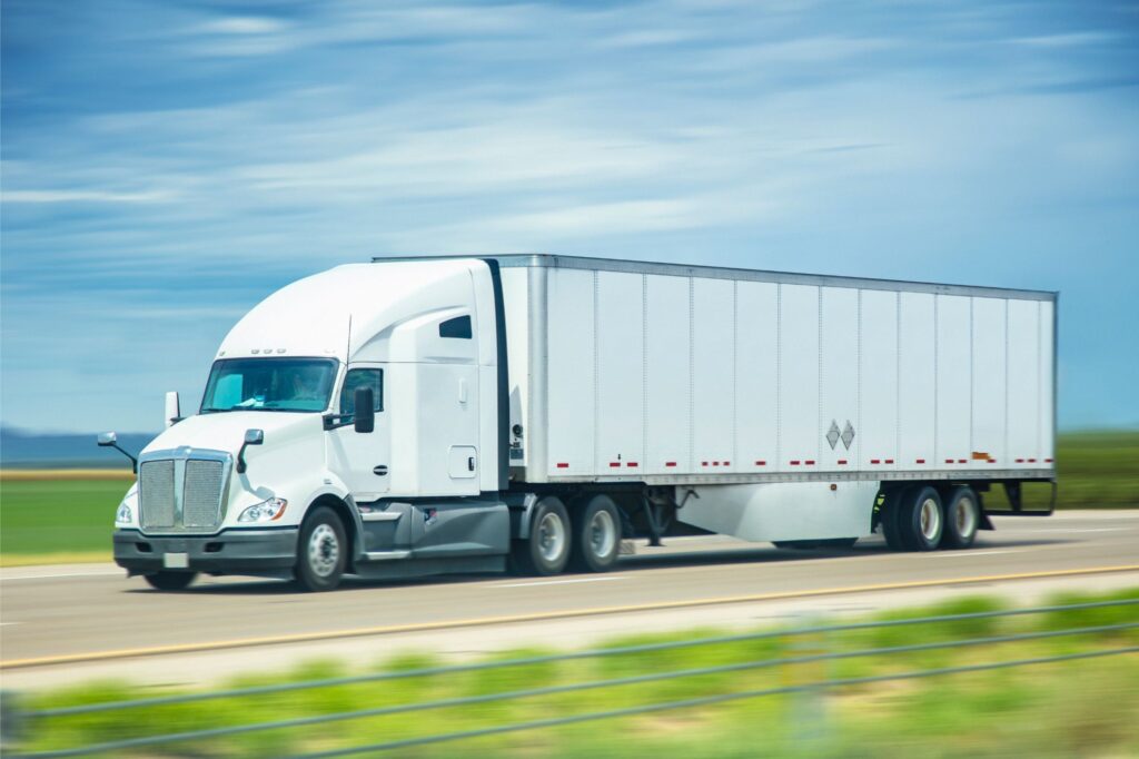 semi truck driving on road - semi truck accident lawyer in west virginia